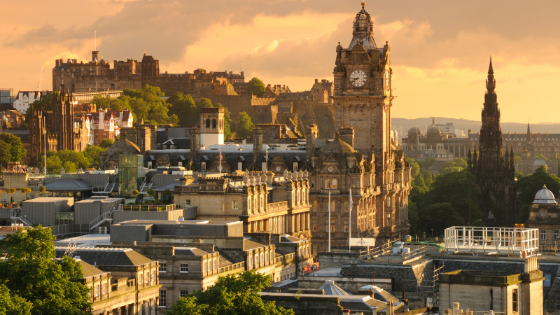 The Edinburgh city skyline at sunset, representing the vibrant opportunities for business loans and funding available across Scotland.