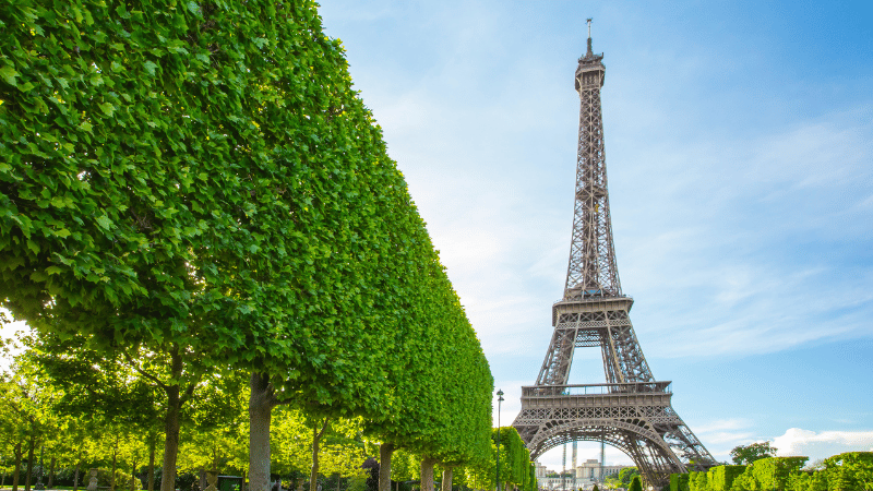 A row of ornate, traditional buildings in Lille, France, with colourful shutters, representing one of the best places for British expats to live.